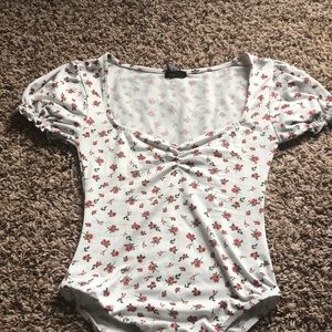 white bodysuit with flower design